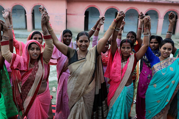 Elected Women Representatives in India hold their hands