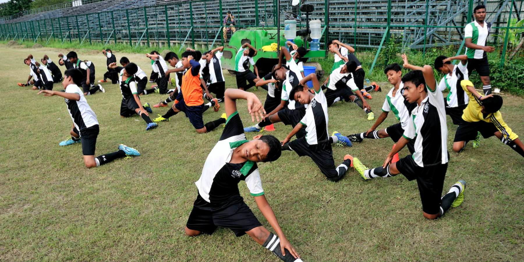 A national level football sporting club based in Kolkata, India, teaches football to a group of young boys from vulnerable communities.