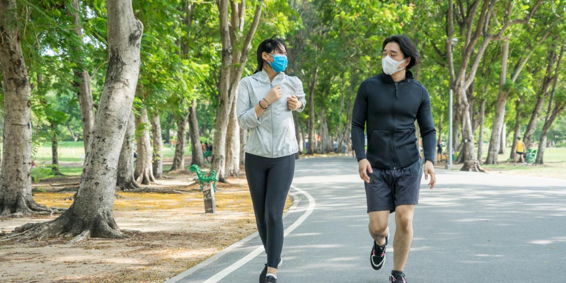 Couple running in park