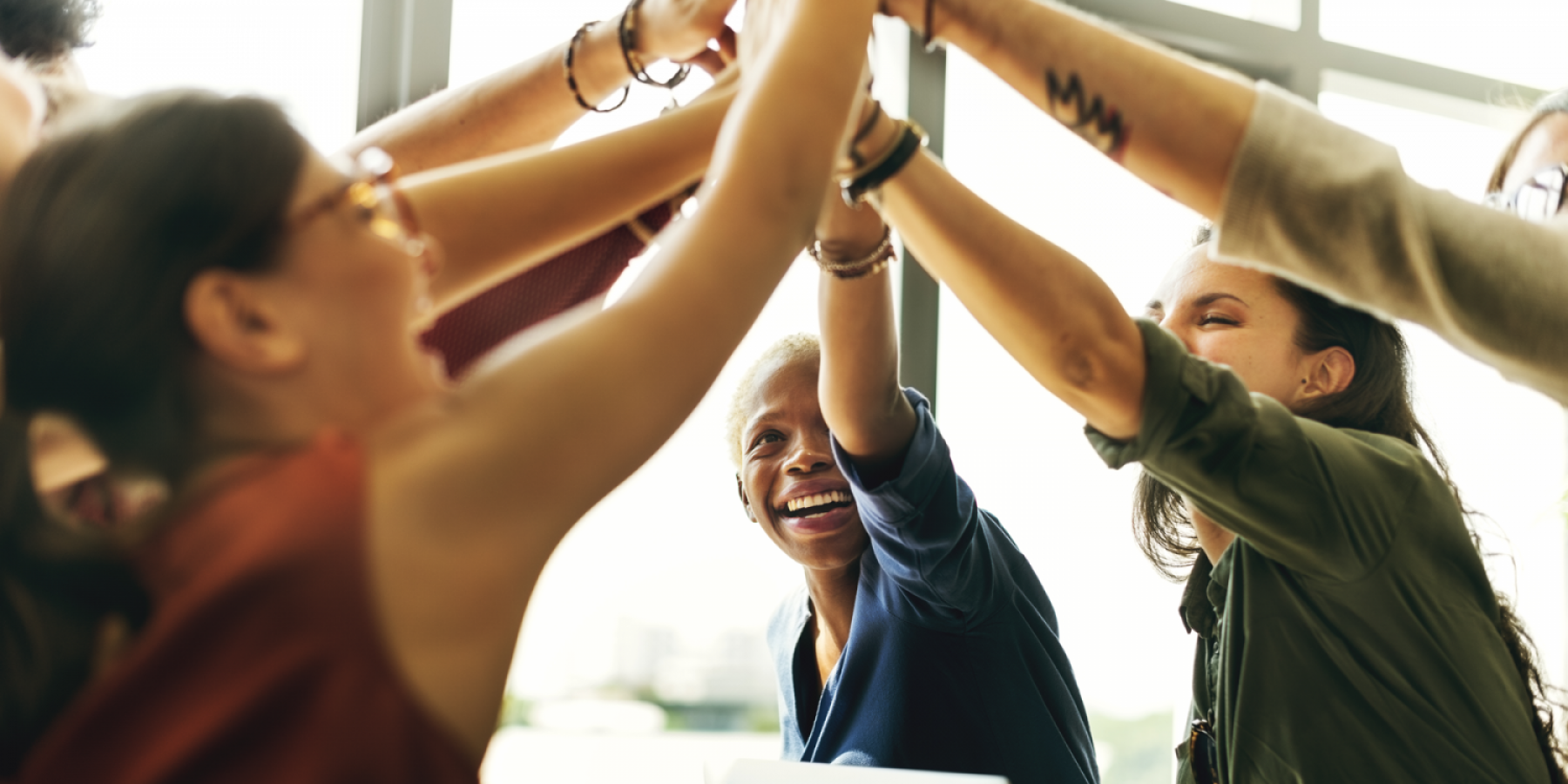 Group of women stretch at work