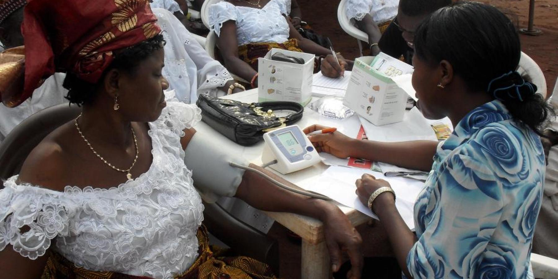 A community health worker gives a health talk on malaria in Agbor, Delta State, Nigeria