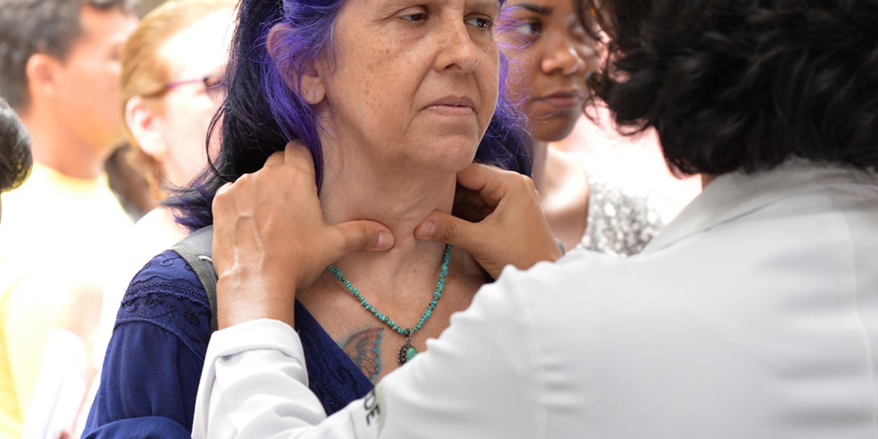 Woman getting her glands checked