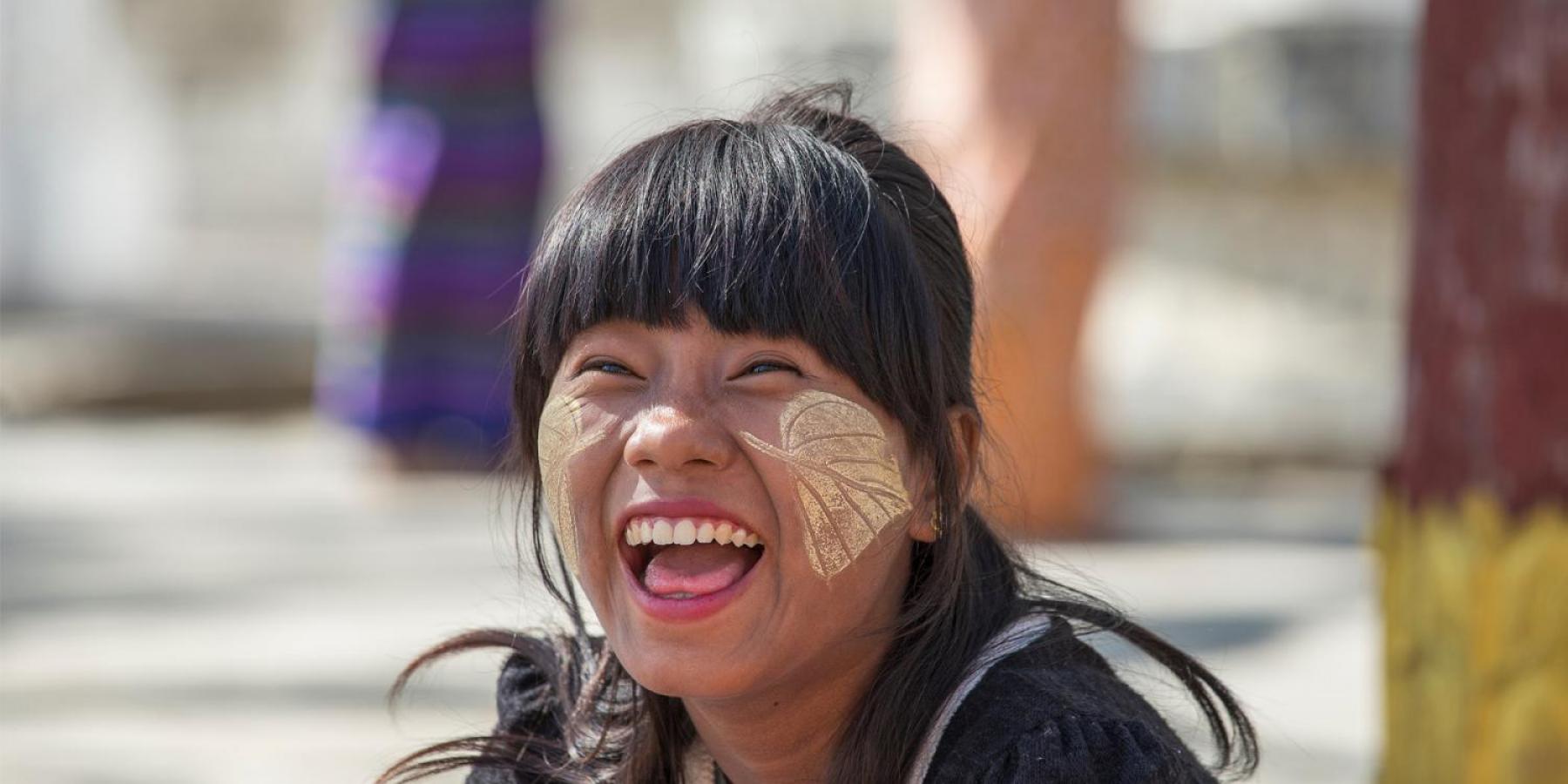 Happy smiling girl with facepaint