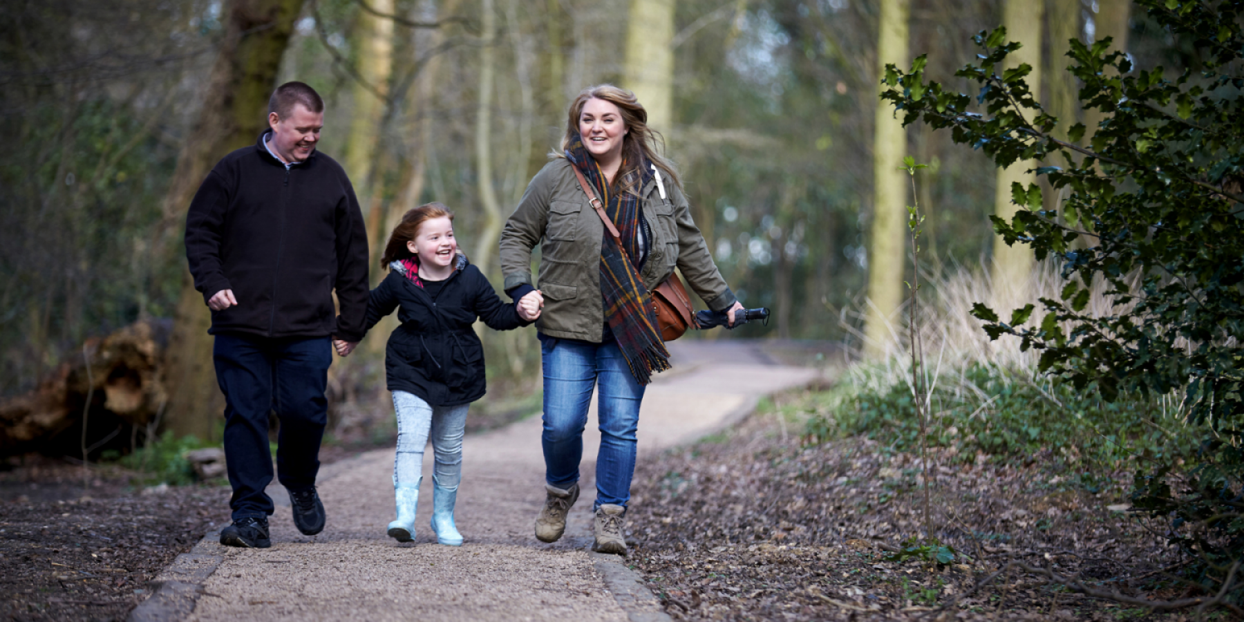 Family walking in the woods