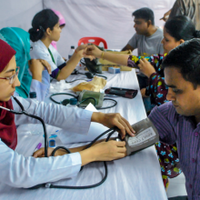 Blood pressure being tested in a health camp 