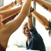 Group of women stretch at work