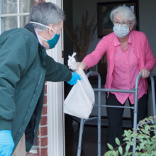 Woman getting groceries during COVID-19