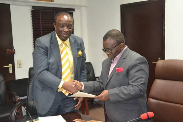 Honourable Minister of Health receiving UNHLM 2018 letter from NCD Alliance Nigeria President, Olorogun Dr Sonny Kuku (OFR) Nigeria